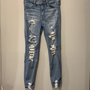 High-rise light wash jeggings with rips